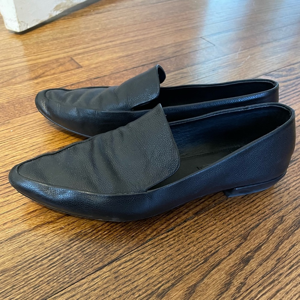 Black leather flats
